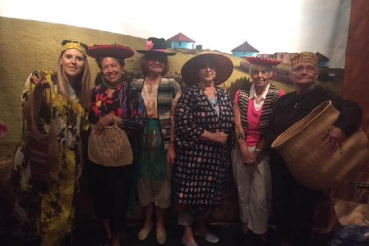 Women Taking Photo Dressed in Different Costumes